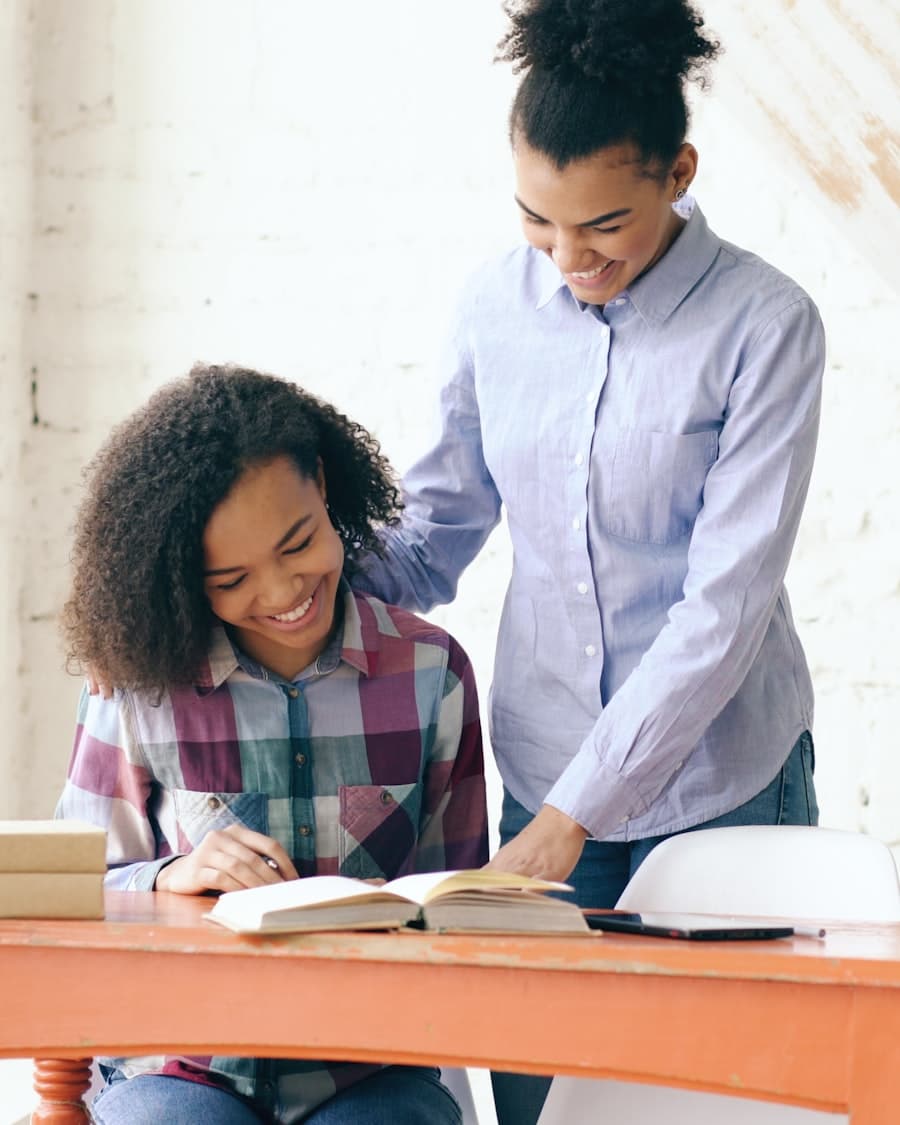 A counselor working through an application with a student